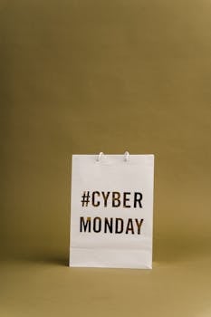Minimalist image of a paper bag with Cyber Monday promotion text.