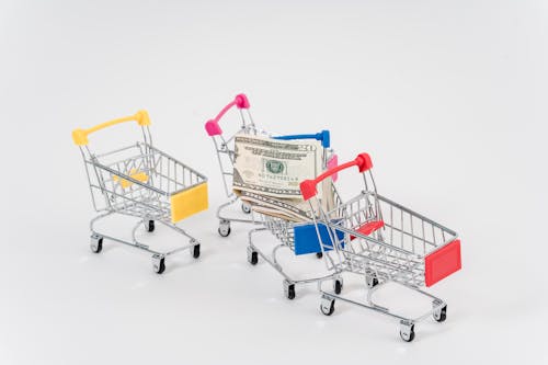 Free Photo Of Mini Shopping Carts With Dollar Bills Stock Photo