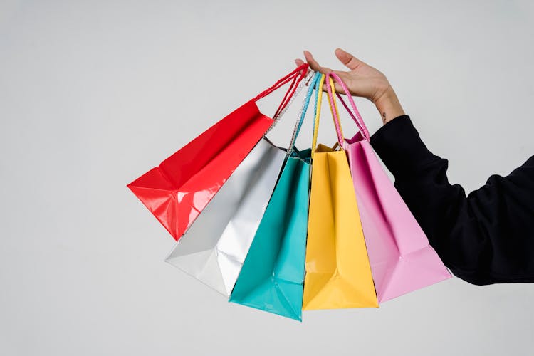 A Person Holding Shopping Bags