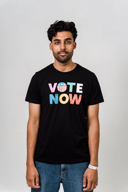 Free Photo Of Man Wearing Black Shirt With Vote Now Text Stock Photo