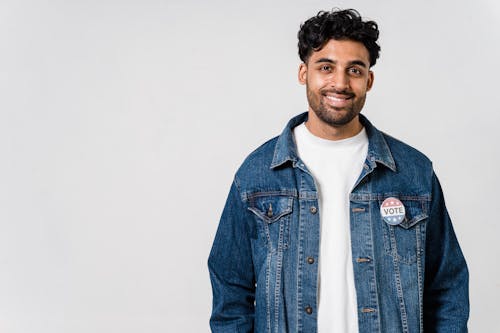 Photo Of Man With Pin Button On His Denim Jacket