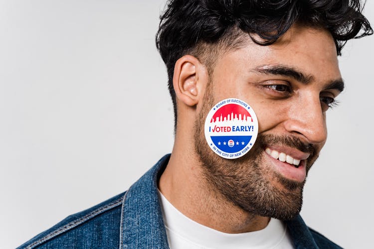 Close Up Shot Of A Man With Sticker On His Face