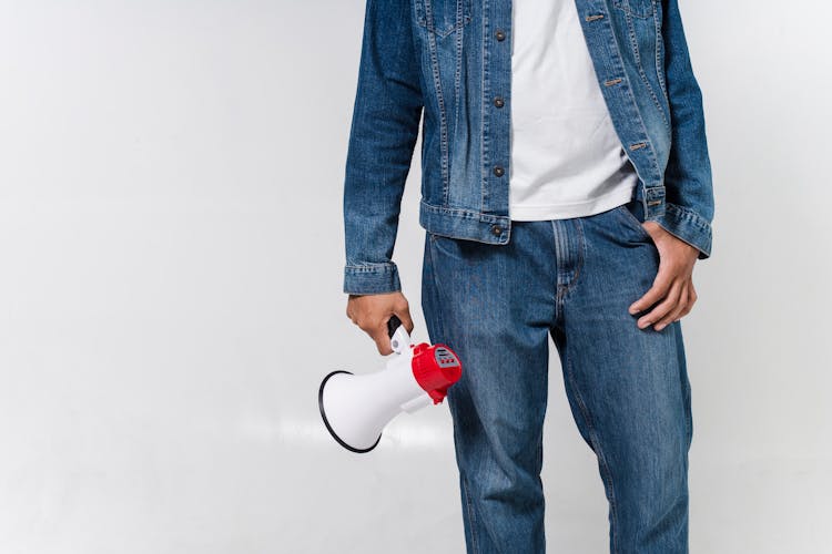 A Person Holding A Megaphone 