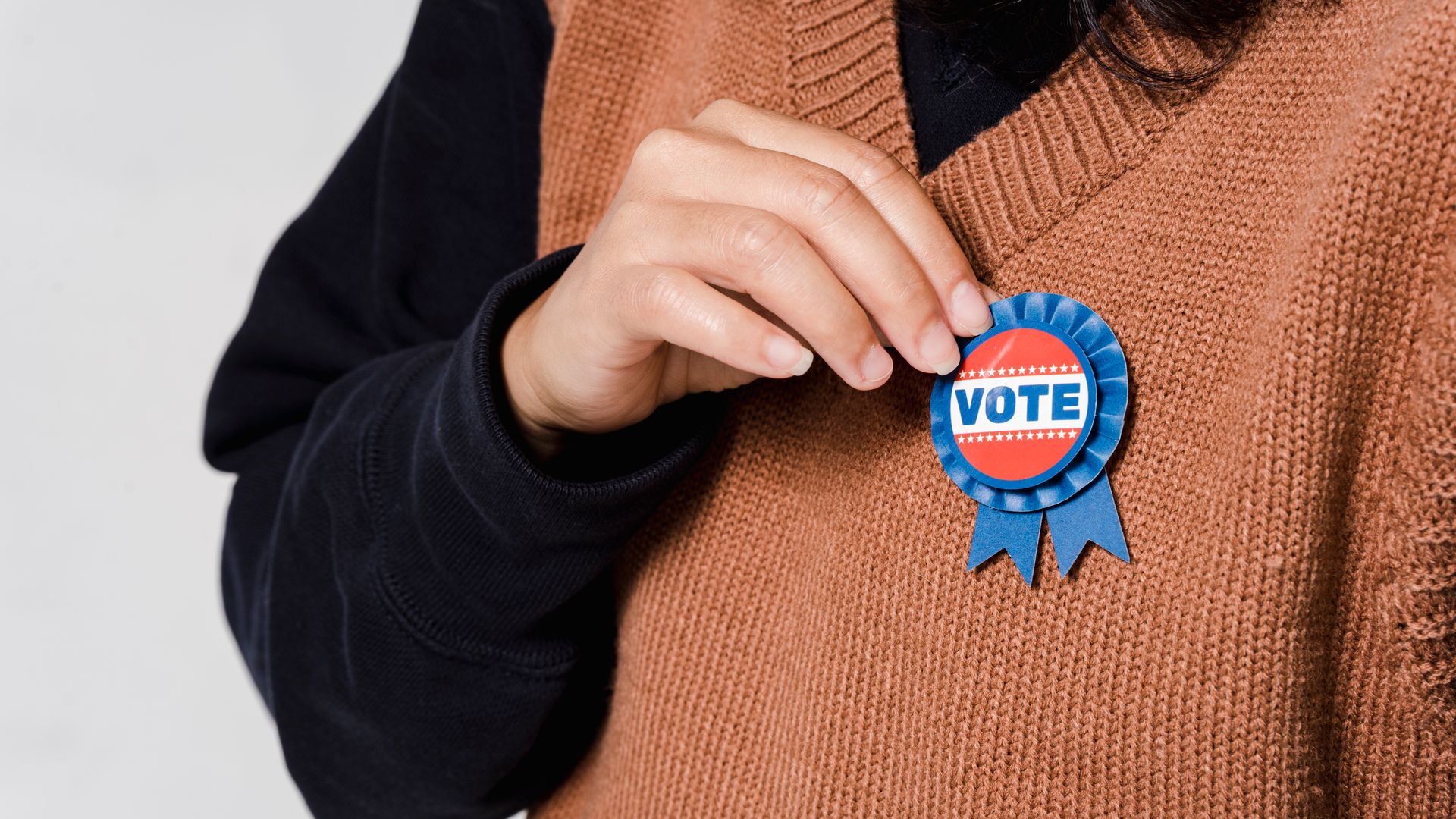 Badge Printing: Your Ultimate Guide to Custom Identification 3 Person wearing a 'Vote' badge, symbolizing participation in democracy and elections — badge printing