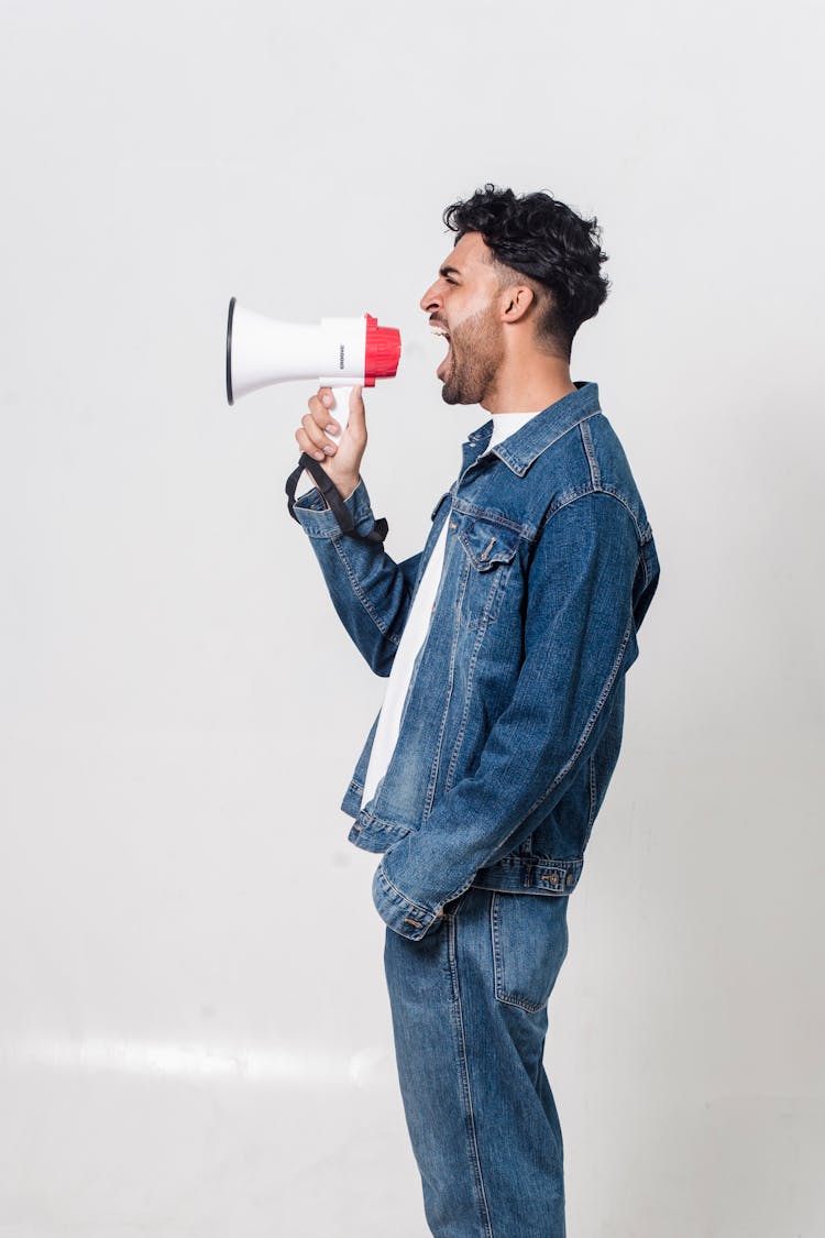 A Man Shouting On A Megaphone