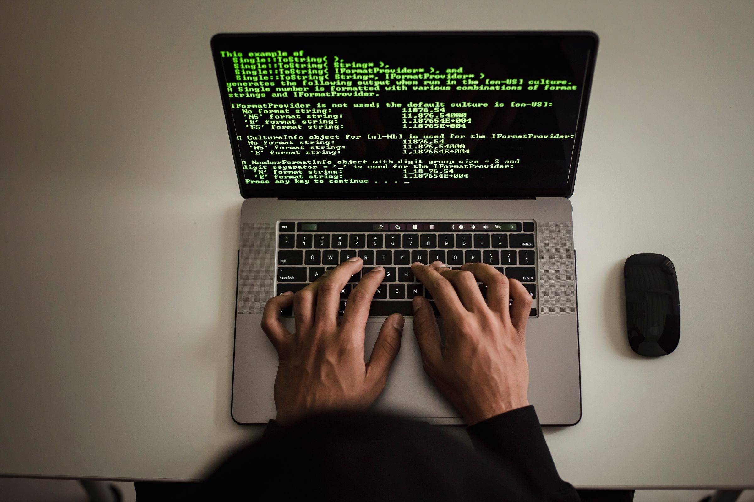 Professional reviewing job opportunities on a laptop and planning applications