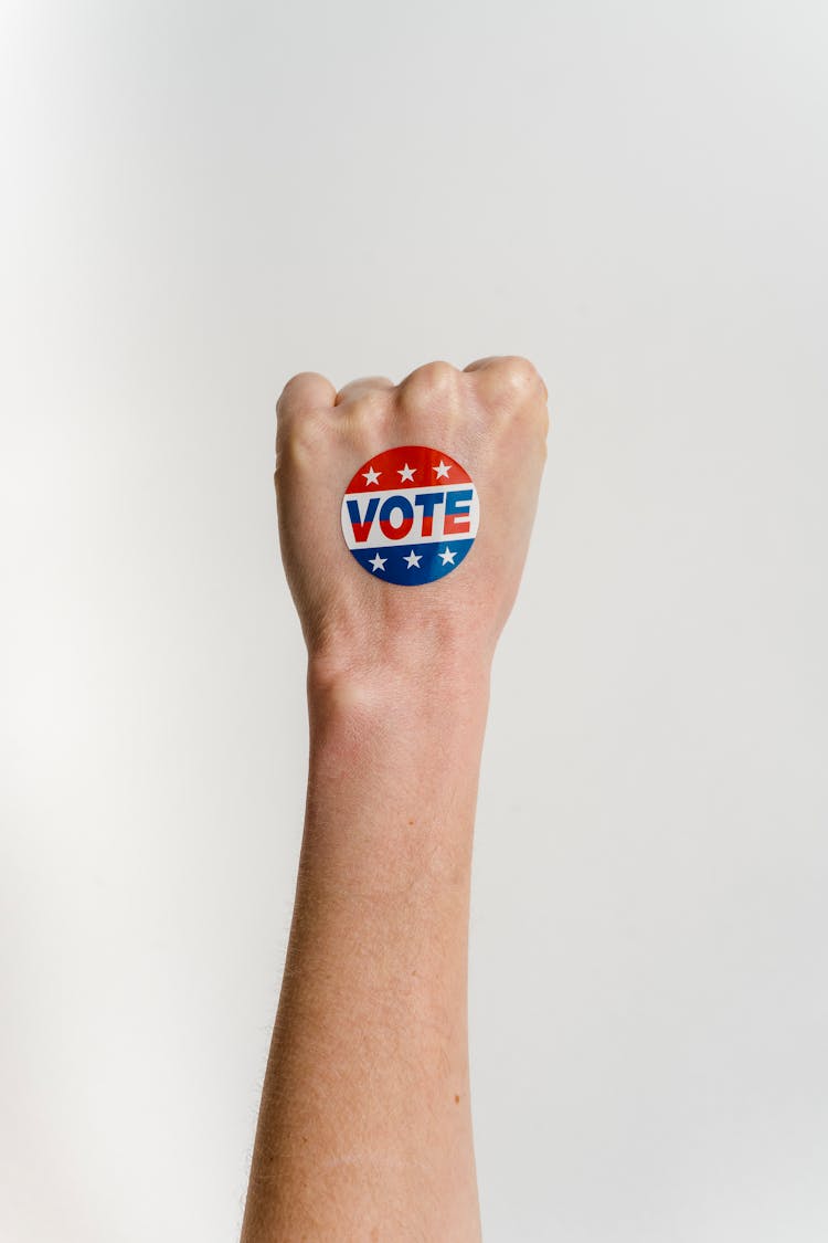 A Fist With A Vote Sticker
