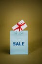 Sale Text On Blue Paper Bag With Gift Box