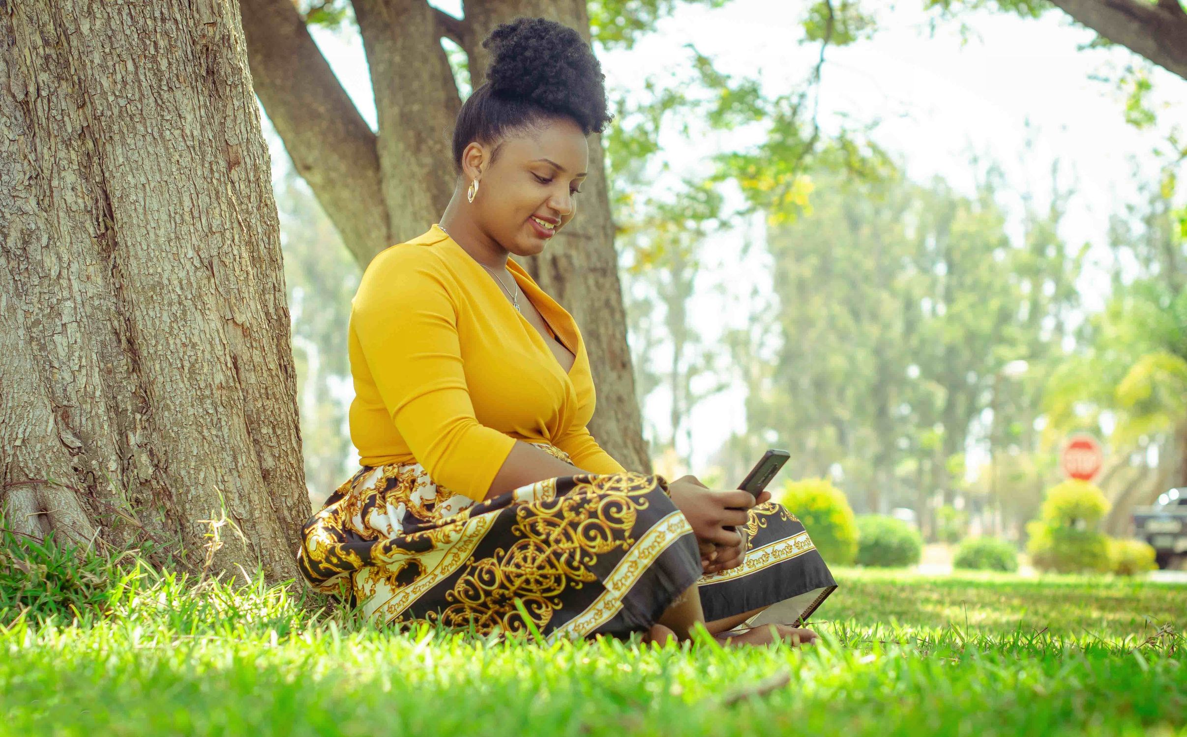 A Woman Sitting on the Grass · Free Stock Photo