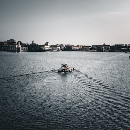 People Riding on Boat on the Sea