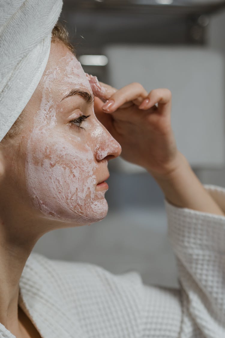 A Woman Applying Clay Mask 