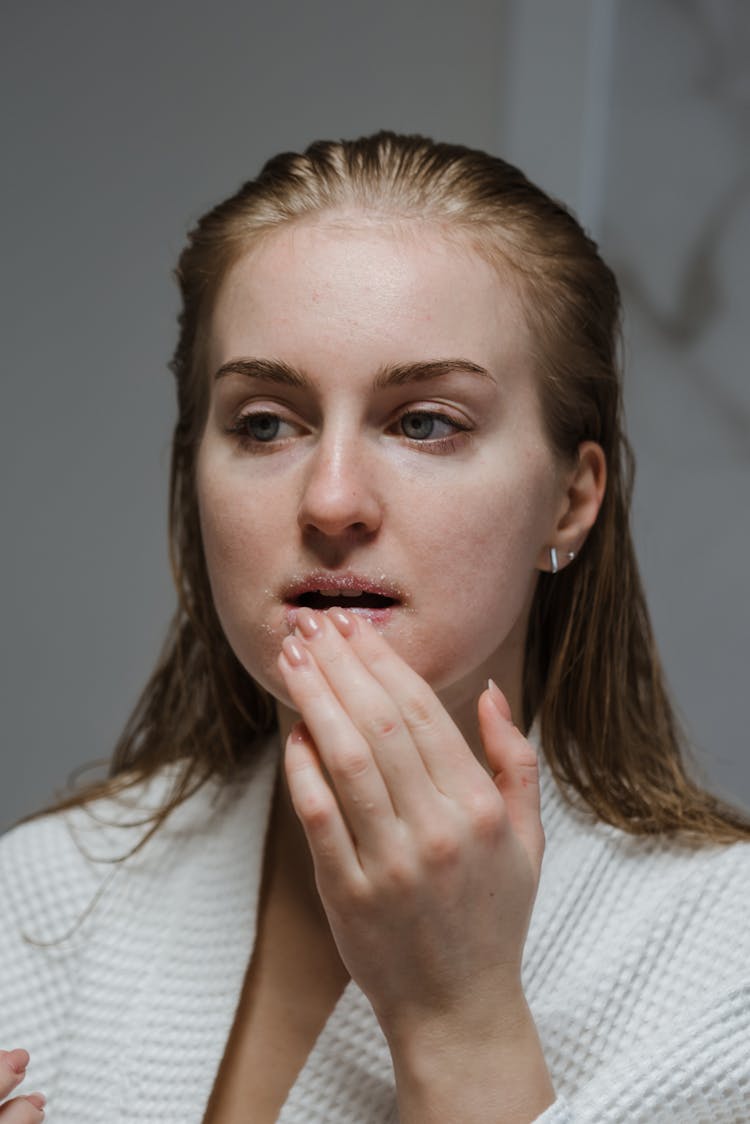 Woman Applying A Lip Scrub 