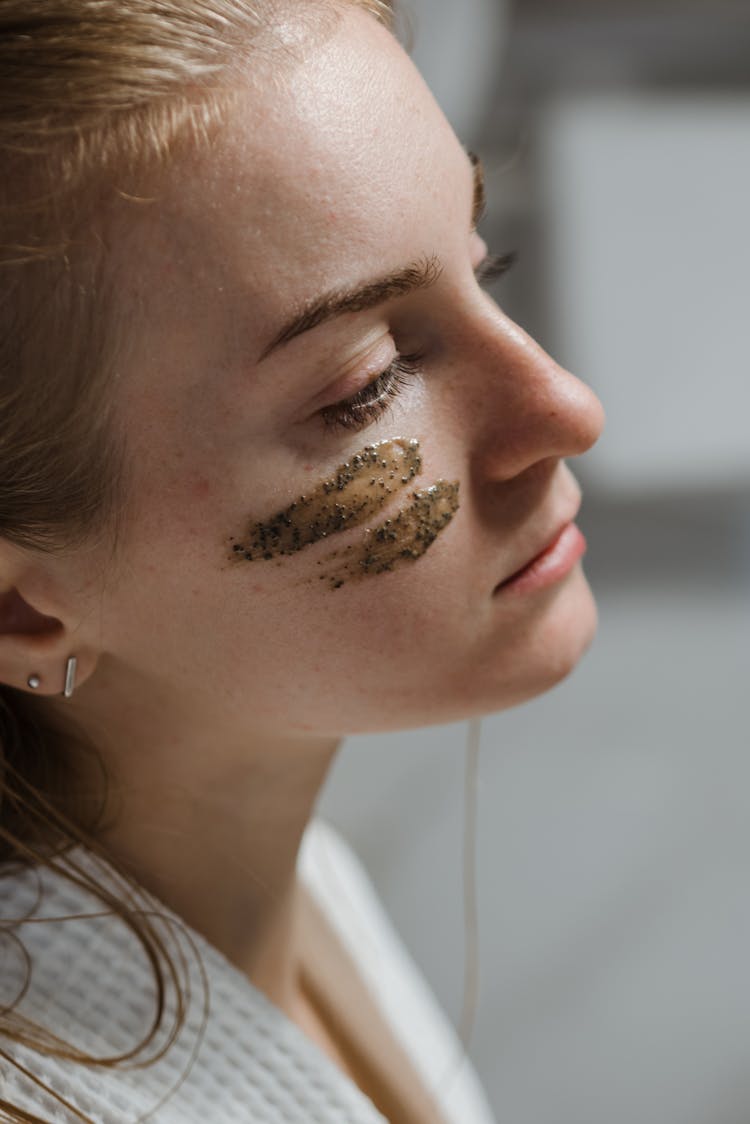 Woman With Coffee Scrub On Face