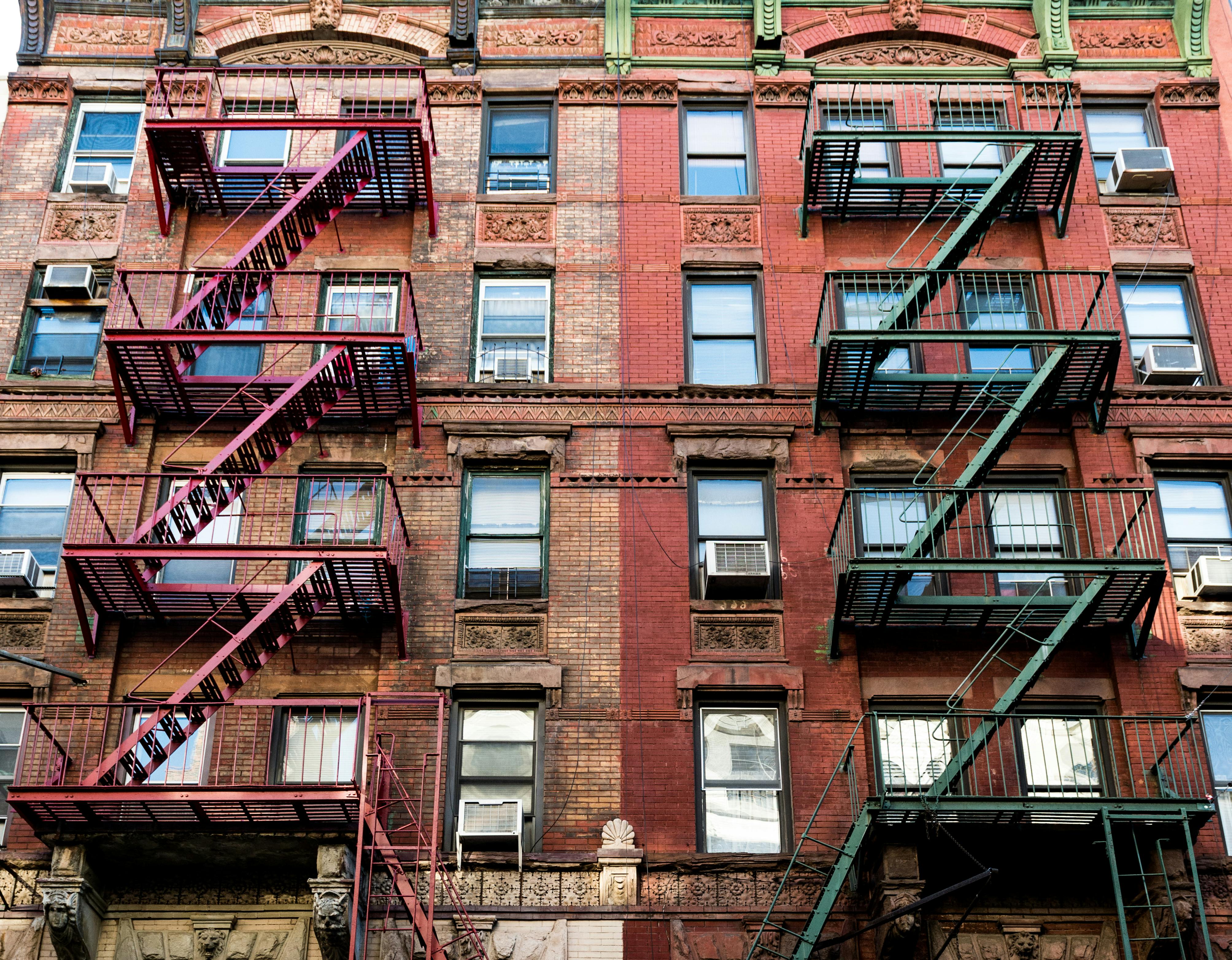 Apartment Building with Fire Escape Ladders · Free Stock Photo