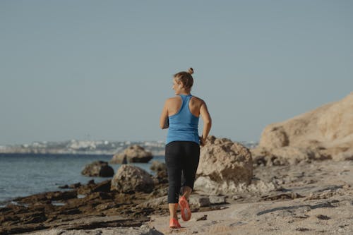 A Woman Running on the Beach