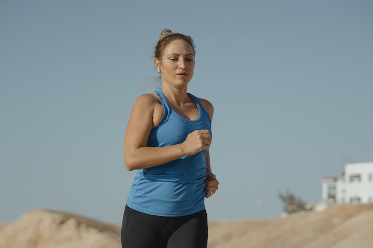 A Woman In A Blue Tank Top