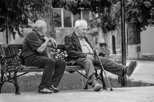 Free Two elderly men conversing on a bench in Yerevan, Armenia. Stock Photo