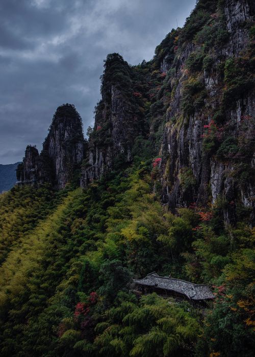 Free Moody mountain scene with rich autumn foliage under a stormy sky. Stock Photo