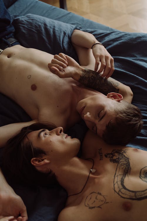 Men Lying on Bed