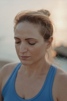 A peaceful moment of meditation by the water at sunset, capturing tranquility and mindfulness.