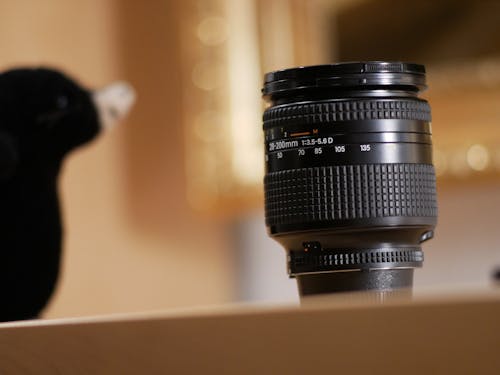 Free Black Camera Lens on Brown Surface Stock Photo