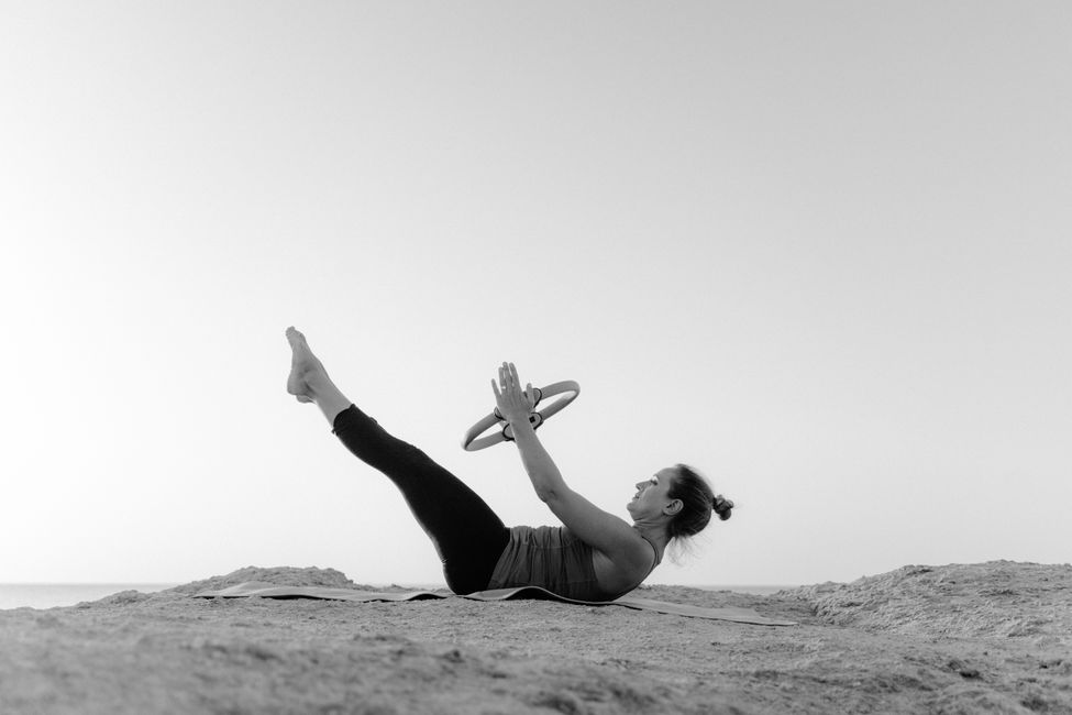 Professional Pilates instructor in a well-equipped studio