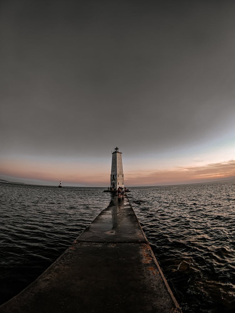 Photo Of A Lighthouse At Dusk