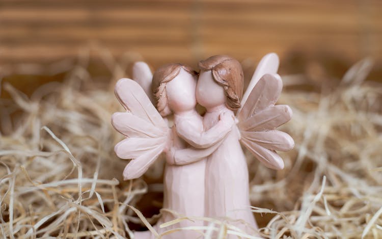 White Angels Figurine Hugging Each Other 