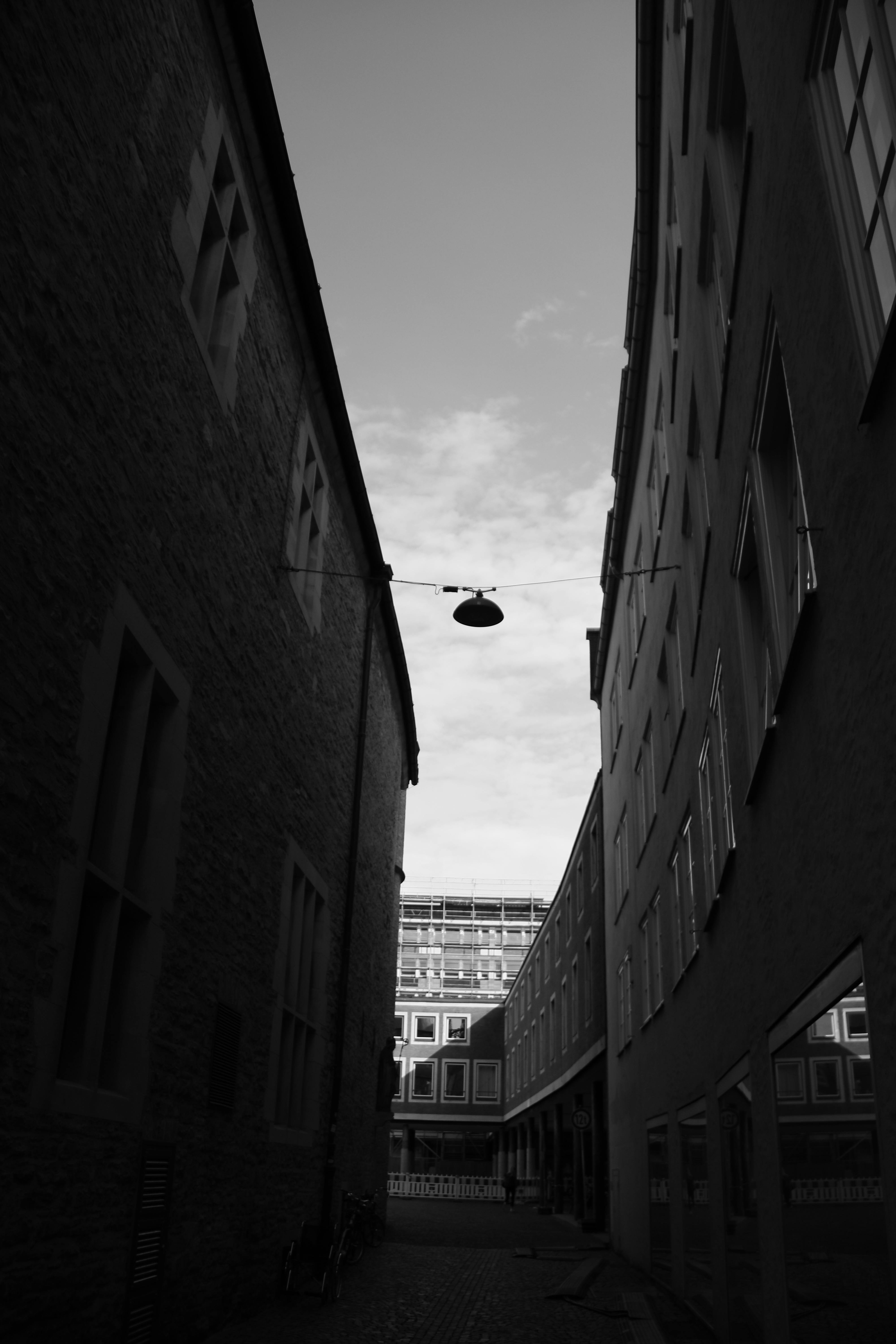 Person checking blood glucose levels near a cup of coffee