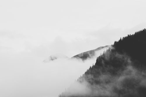 Free Serene black and white landscape of misty mountains in Trentino-Südtirol, Italy. Stock Photo