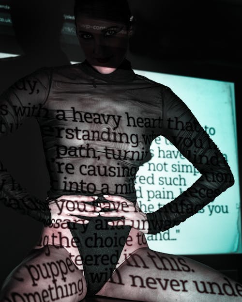 Woman in Bodysuit with Letters Shadows on Body