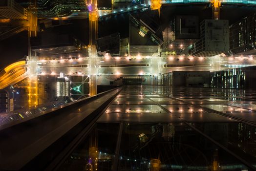 Stunning aerial view of illuminated downtown Chicago streets at night, showcasing urban architecture.
