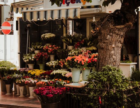 Beautiful outdoor flower shop with an array of colorful blooms and lush greenery.