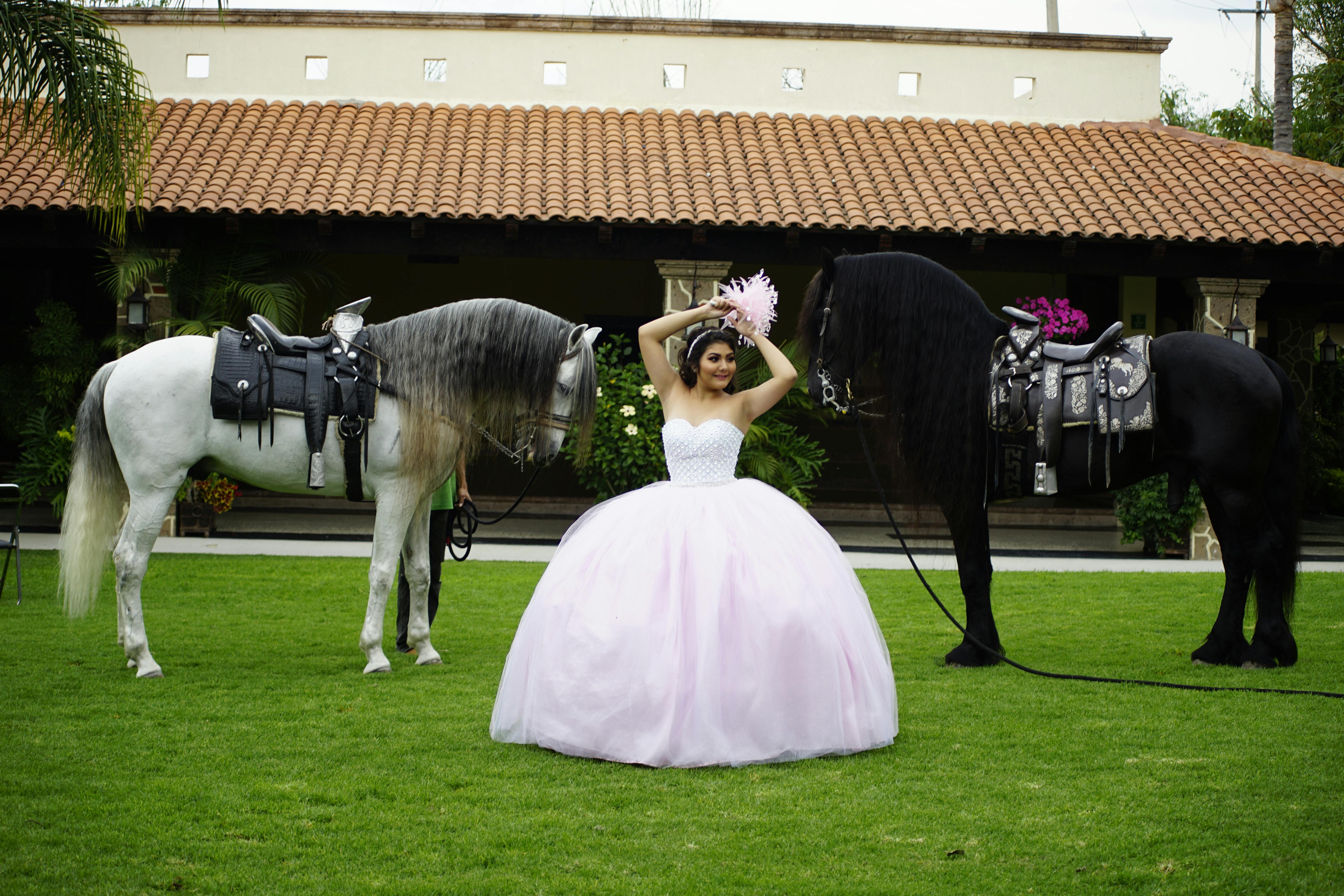 woman in white ball gown holding a bouquet