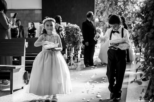 Free Grayscale Photo of Kids Walking Down the Aisle Stock Photo