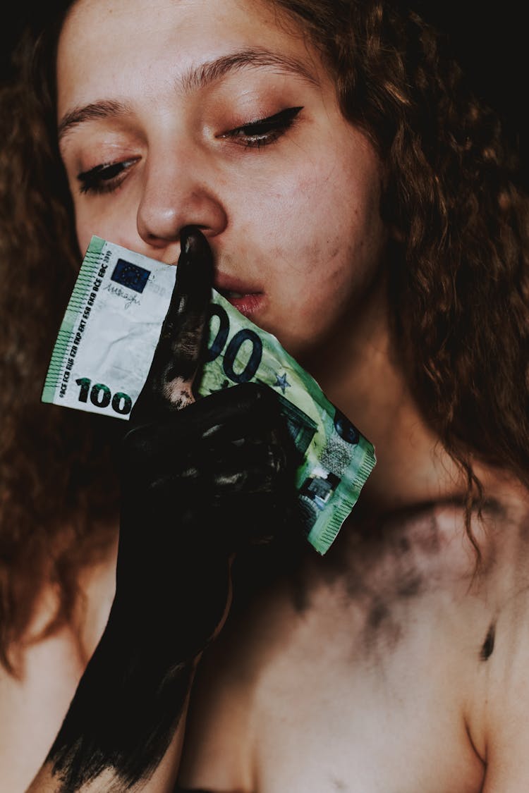 Young Woman With Dirty Hand And Banknote