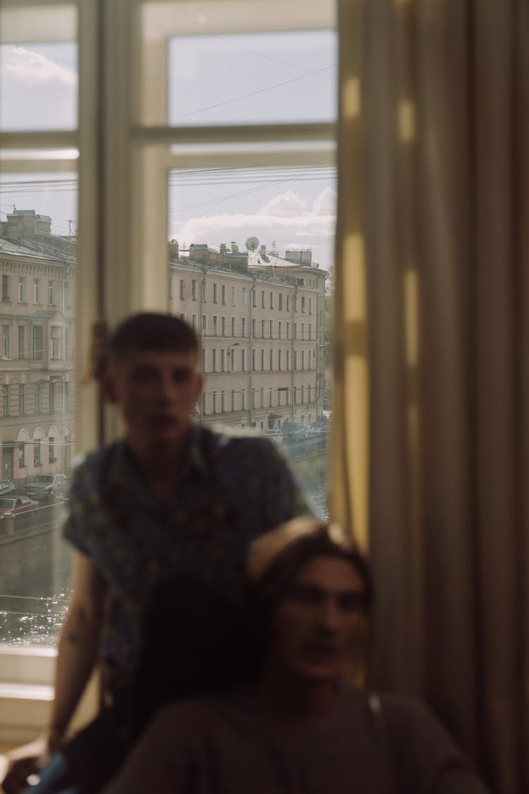 Blurred Photo Of Guys Inside An Apartment