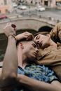 Couple Lying in Each Other's Arms by the Windowsill