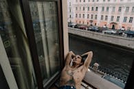 A Person Lying near the Window