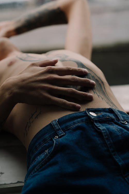 Free Hand on the Stomach Stock Photo