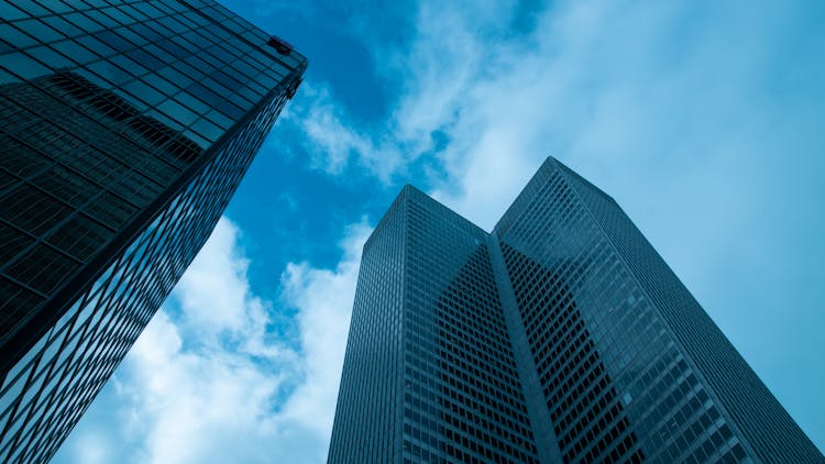 High Rise Glass Buildings Under Blue Sky