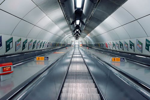 Symmetrical View of an Escalator Tunnel 