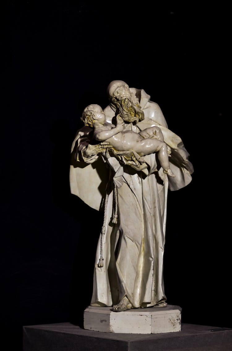 Renaissance Statue Against Black Background