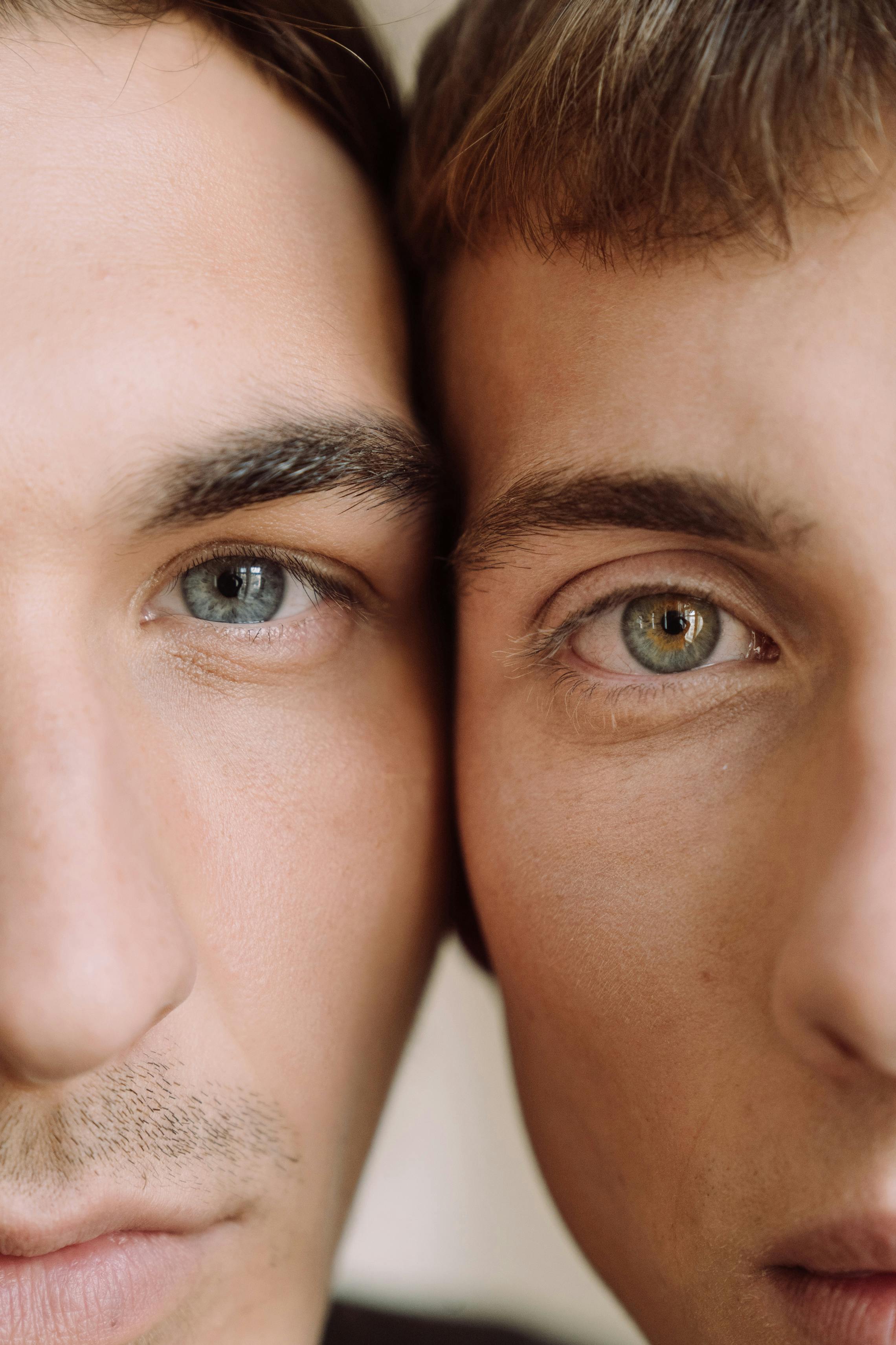 close up view of two faces of men
