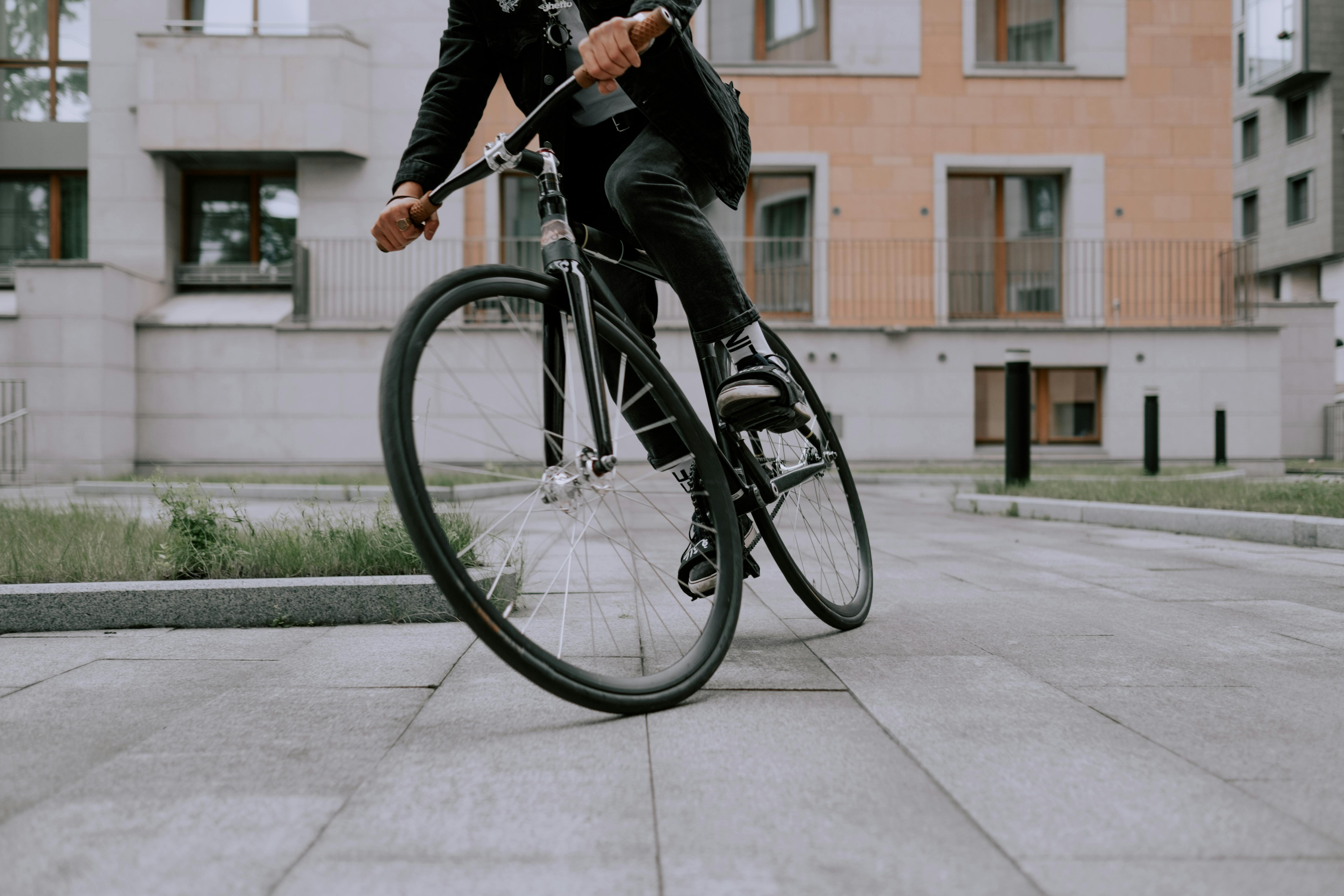 Man Riding Black Mountain Bike on Pathway during Daytime · Free Stock Photo