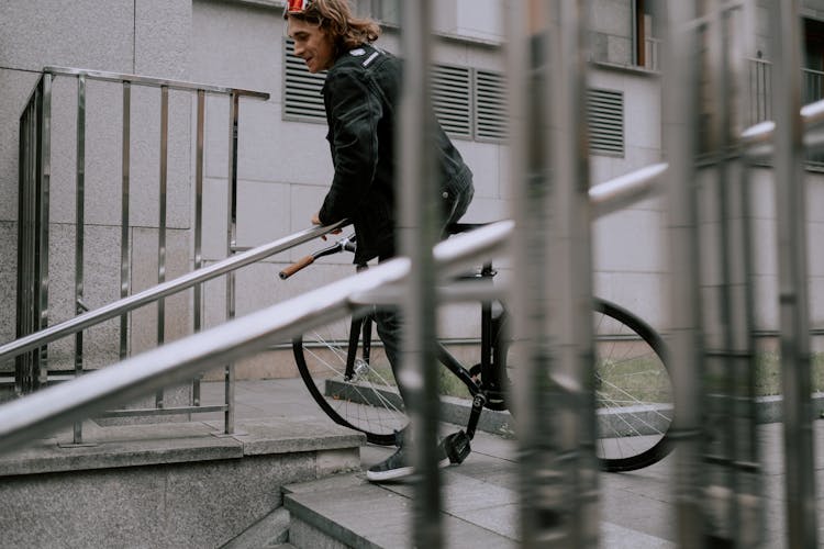 A Man Riding A Bike 