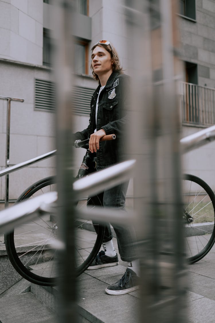 Man In Black Jacket Riding A Bike For Transportation