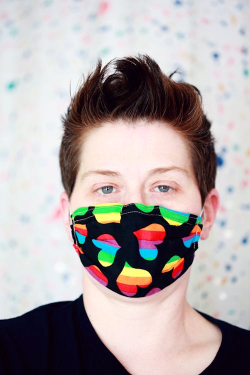 Woman Wearing a Rainbow Heart Design Facemask