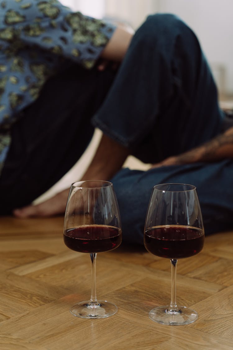 Wine Glasses On The Wooden Floor