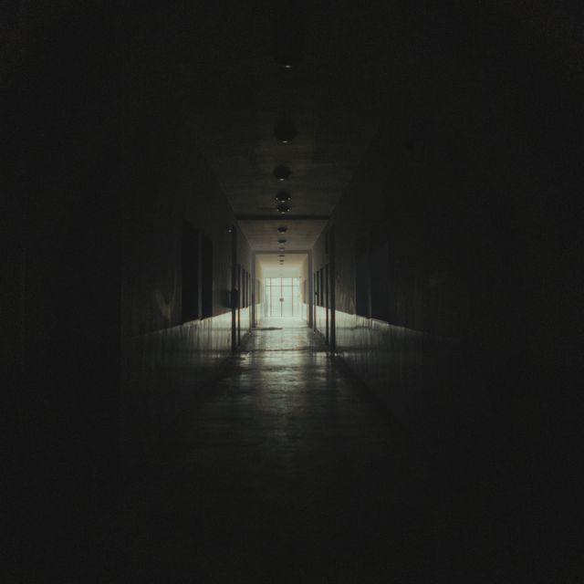 Dim interior corridor at night, photo by Amine Mayoufi on Pexels